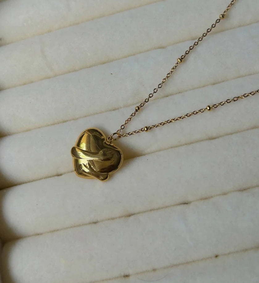 The golden hug pendant