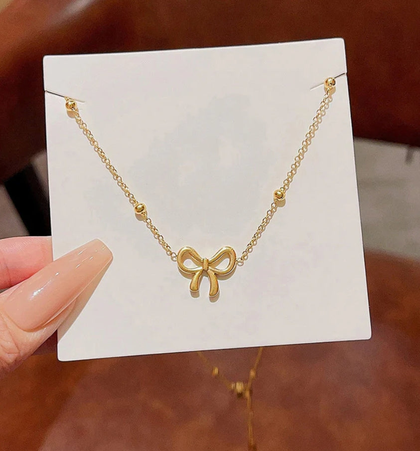 Aura bow necklace