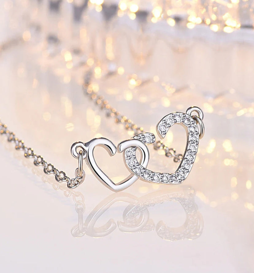 Dual heart pendant