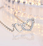Dual heart pendant