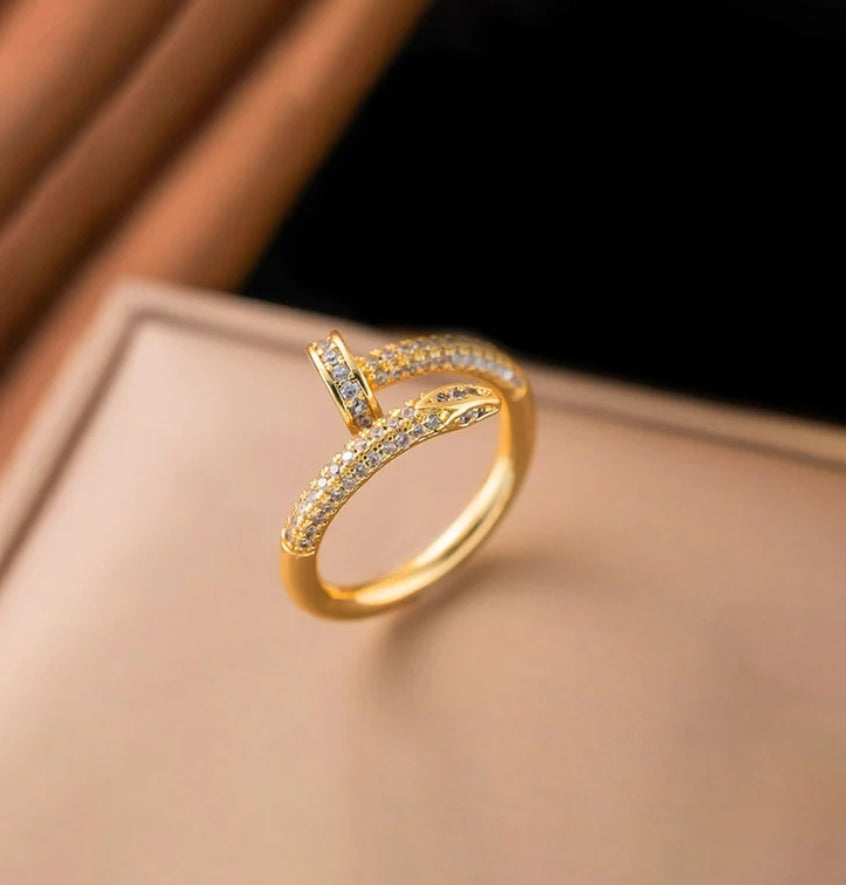 Nail themed adjustable ring