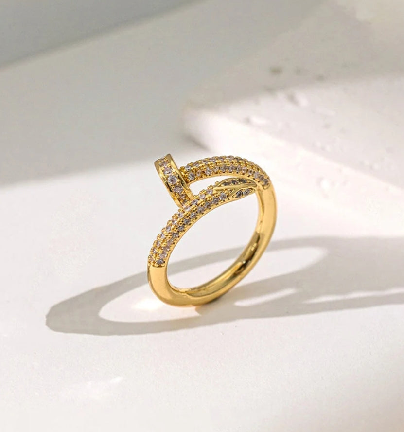 Nail themed adjustable ring
